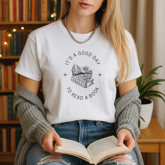 White book lover t-shirt showcasing a black stack-of-books illustration and “It’s a good day to read a book” slogan.